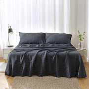 French Linen Sheet Set by Highland Feather styled on bed – Natural Breathable Bedding in Sage Green, Charcoal Grey, Khaki & White